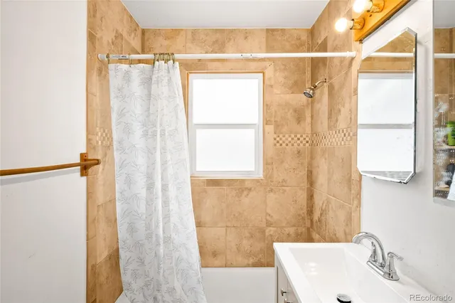 a bathroom with a sink and a shower