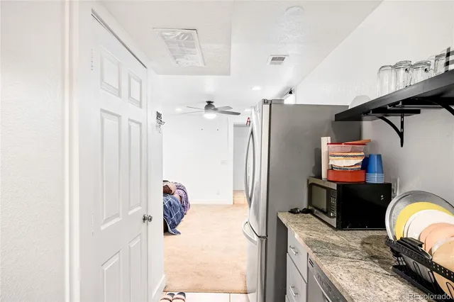 a bedroom with furniture and a wooden floor