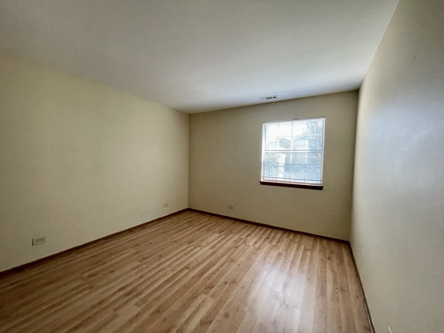 20 Gant Circle, Unit E Streamwood, IL 60107 - Photo 14 of 21 an empty room with wooden floor and windows
