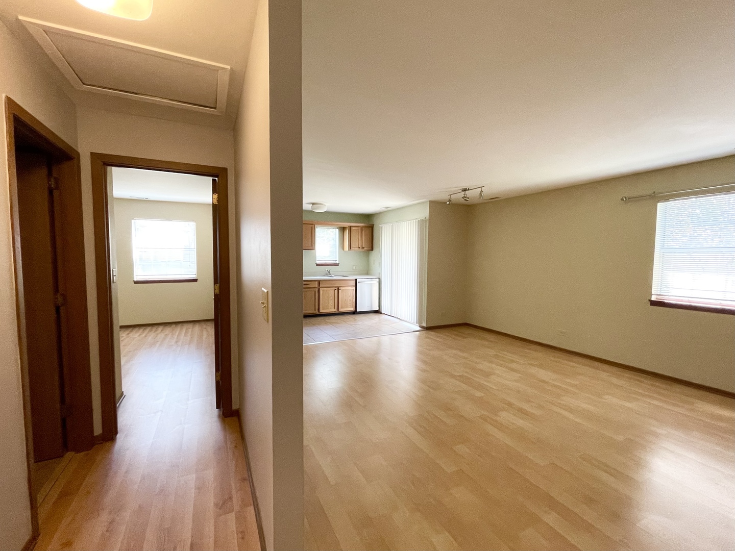 20 Gant Circle, Unit E Streamwood, IL 60107 - Photo 15 of 21 a view of a hallway with wooden floor and a bathroom