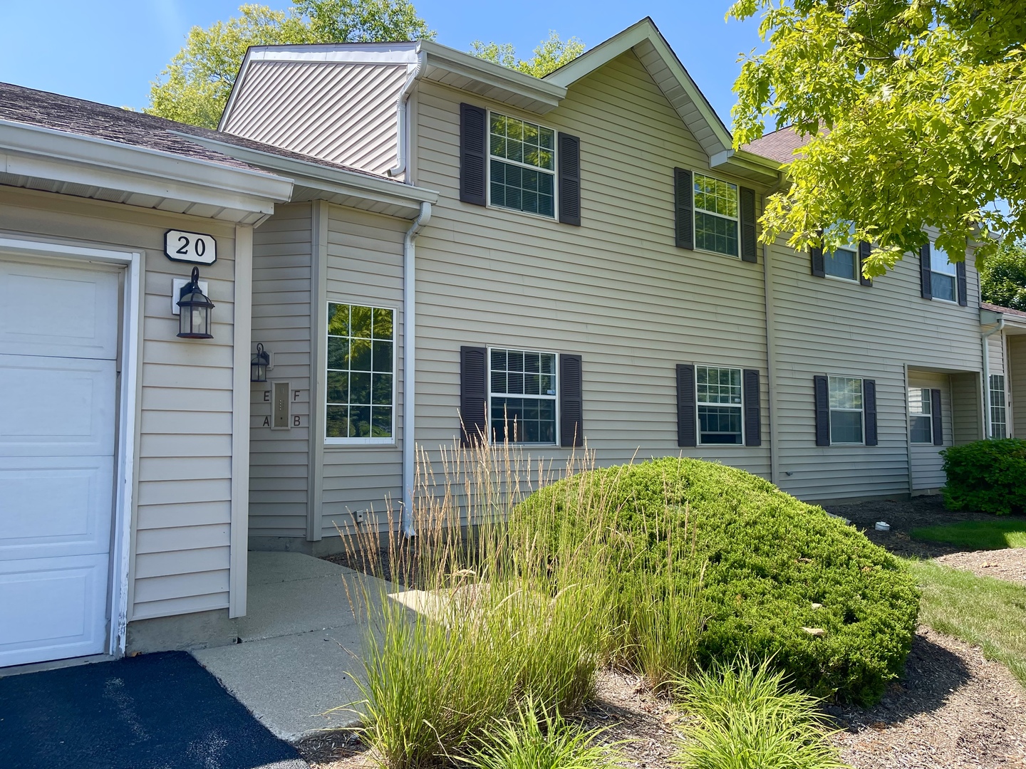 20 Gant Circle, Unit E Streamwood, IL 60107 - Photo 2 of 21 a view of front of house with a yard