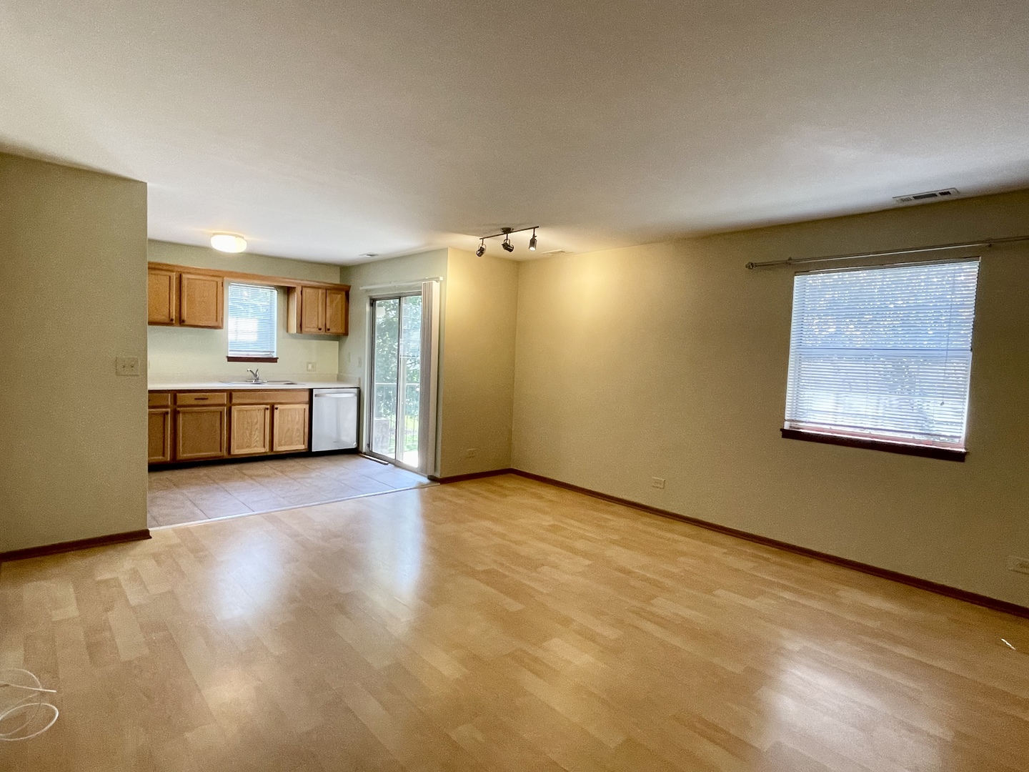 20 Gant Circle, Unit E Streamwood, IL 60107 - Photo 8 of 21 a view of a kitchen with a sink and a refrigerator