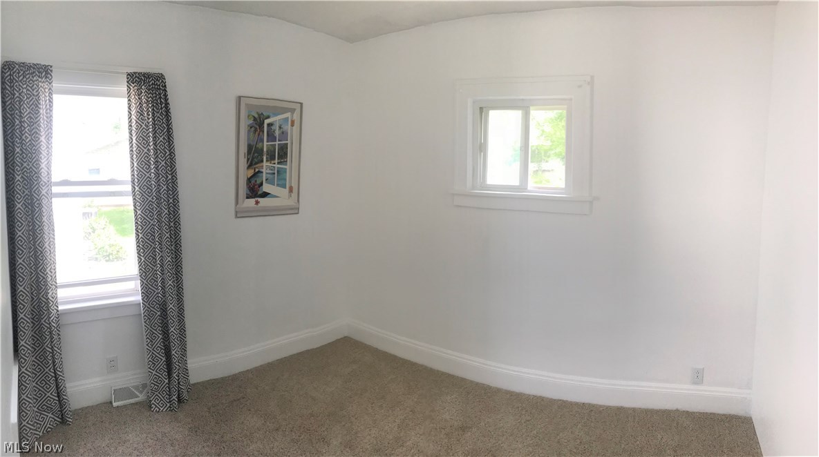 1387 Irene Road Lyndhurst, OH 44124 - Photo 10 of 14 First floor bedroom, freshly painted, walls are square, distorted from panoramic pic