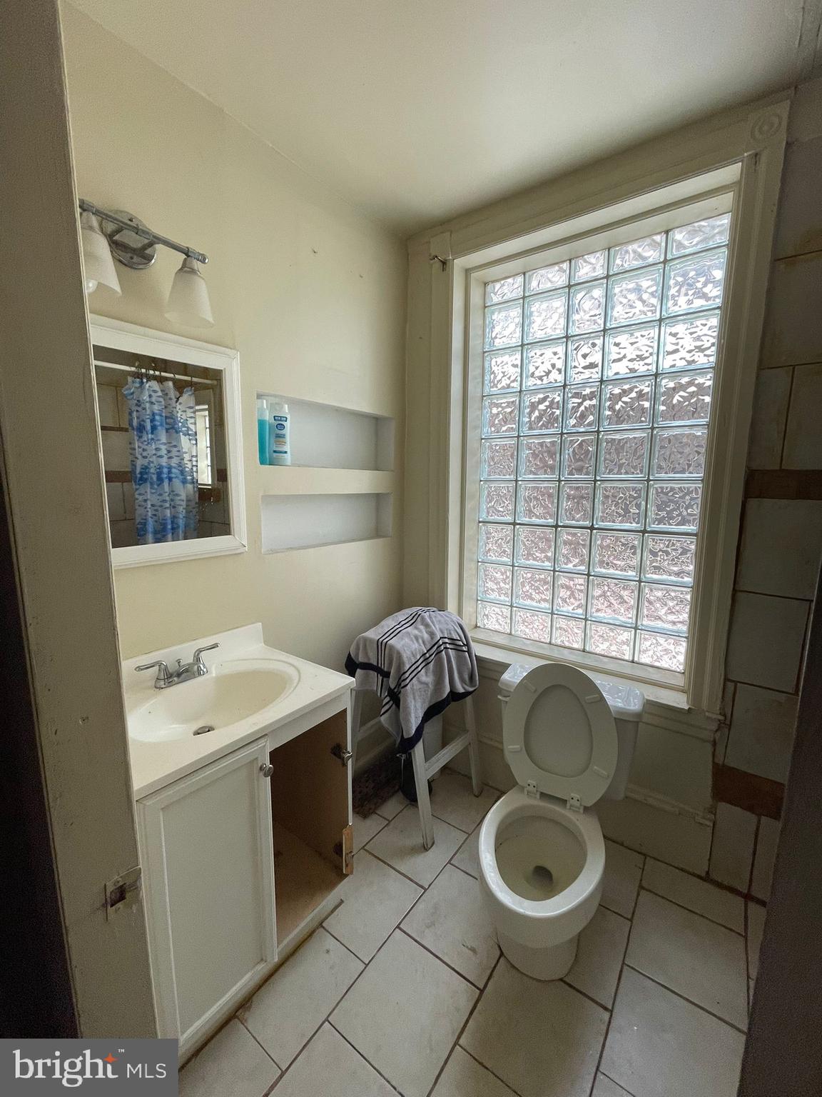 5809 Chew Avenue Philadelphia, PA 19138 - Photo 20 of 29 a bathroom with a toilet sink and window