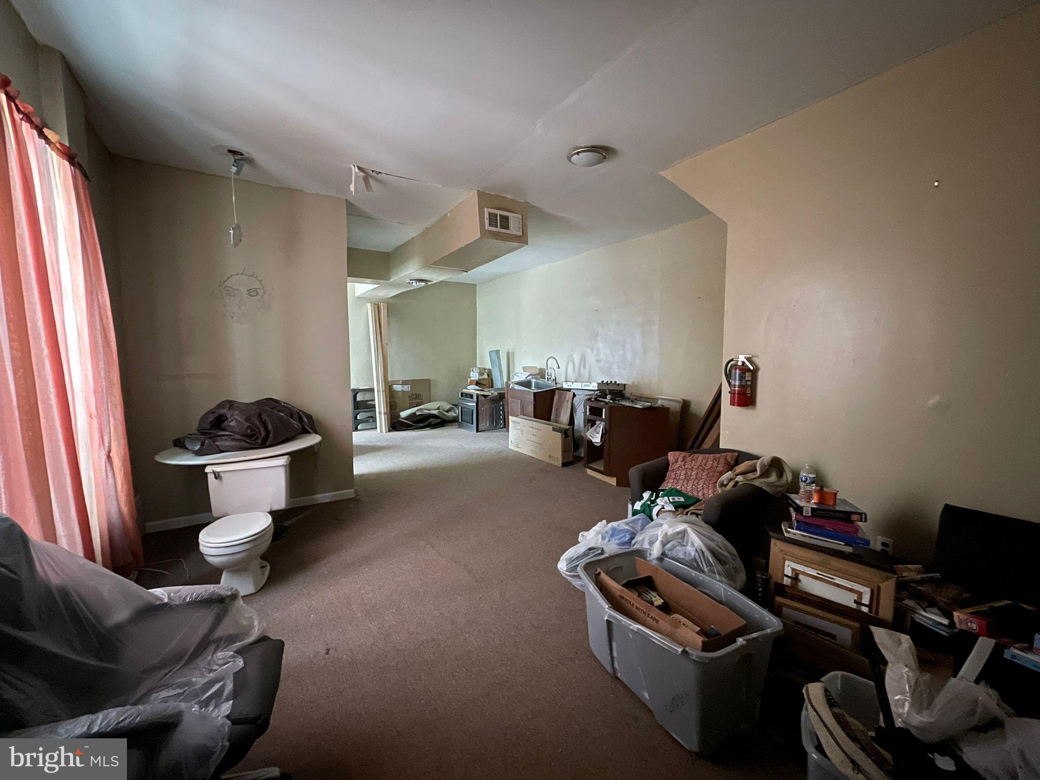 5809 Chew Avenue Philadelphia, PA 19138 - Photo 21 of 29 a living room with furniture a couch and a window
