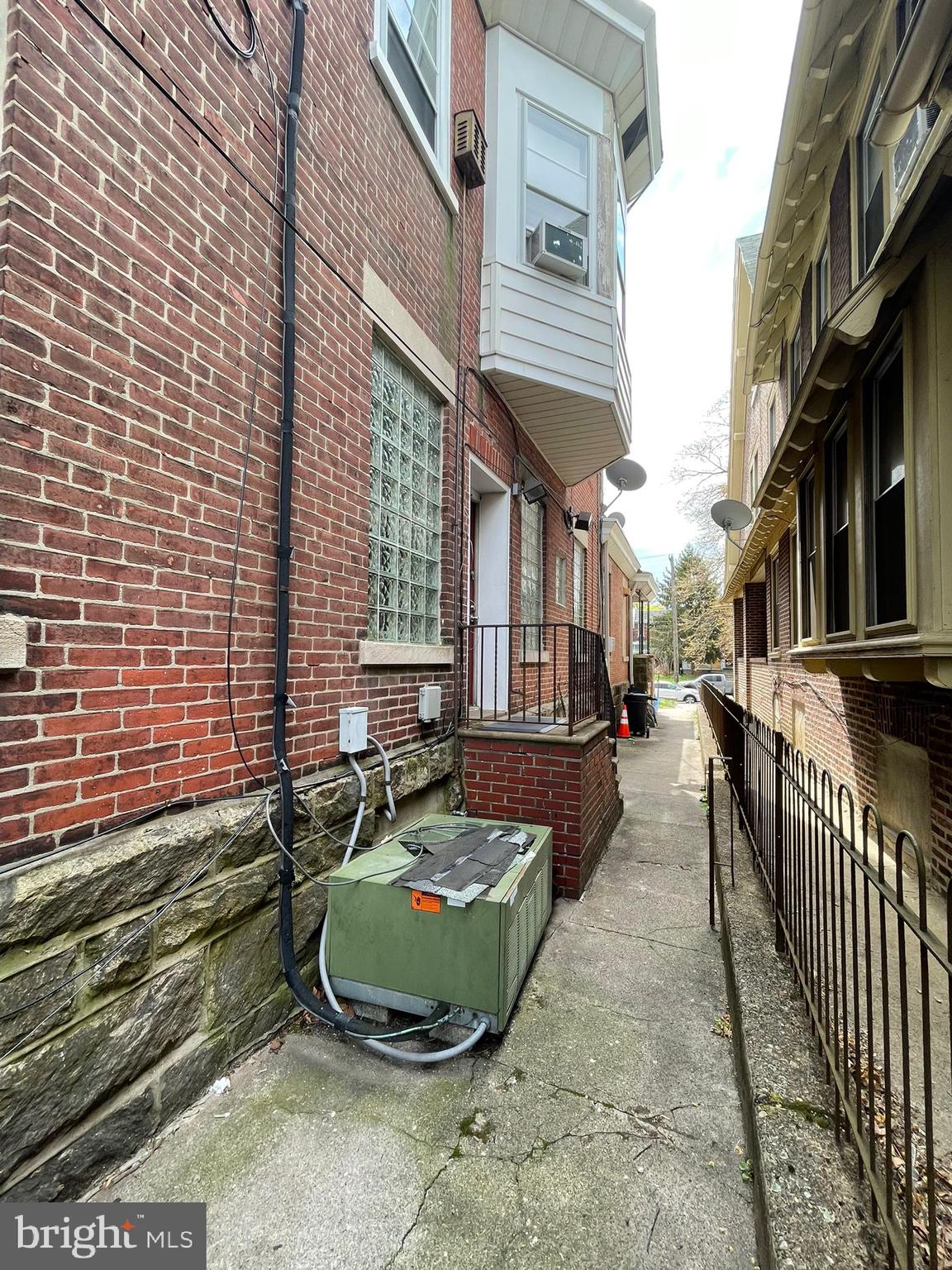 5809 Chew Avenue Philadelphia, PA 19138 - Photo 25 of 29 a view of a brick house with a backyard and sitting area