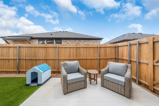 a balcony with furniture and a garden