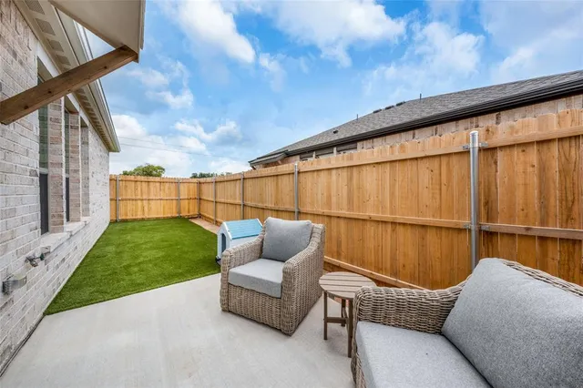 a backyard of a house with sofas
