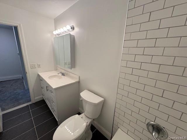 23 Brewster Road Cornwall, NY 12518 - Photo 24 of 39 Bathroom with vanity, toilet, tiled flooring and walls