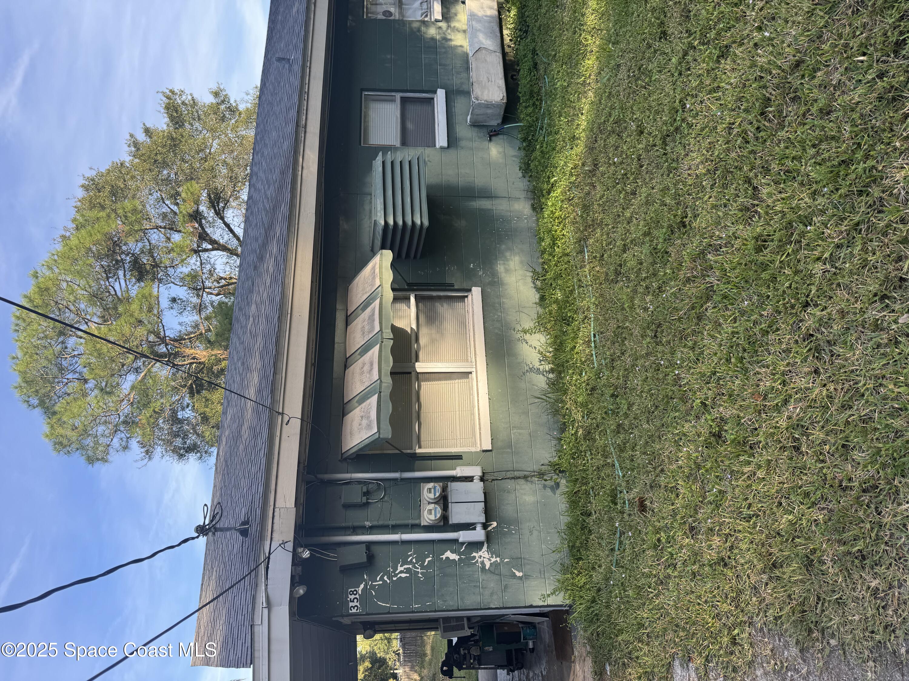 358 Palm Avenue Cocoa, FL 32922 - Photo 1 of 4 a front view of a house with garden