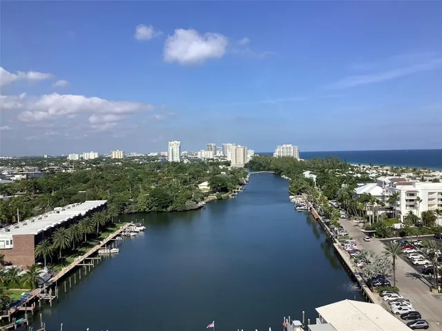 an aerial view of residential building with green space
