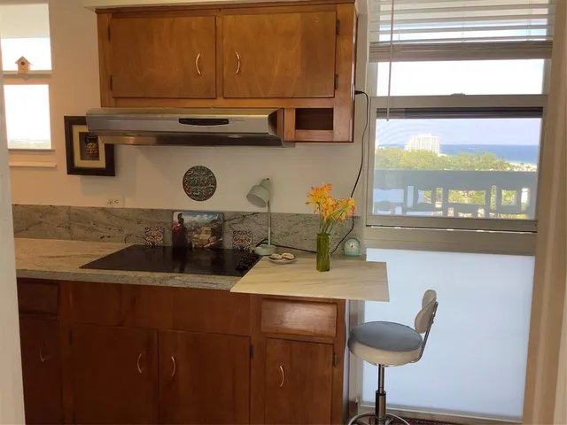 a kitchen with a sink and a window