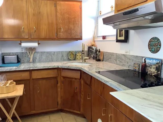 a kitchen with a sink cabinets and appliances