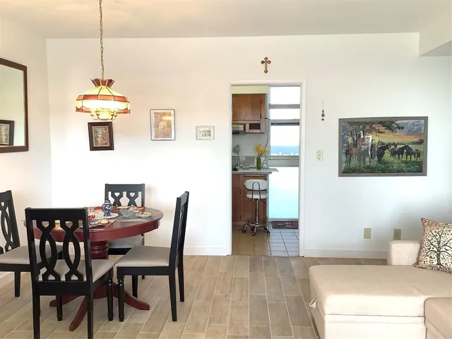 a dining room with furniture and window
