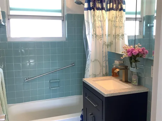 a bathroom with a sink and a bathtub