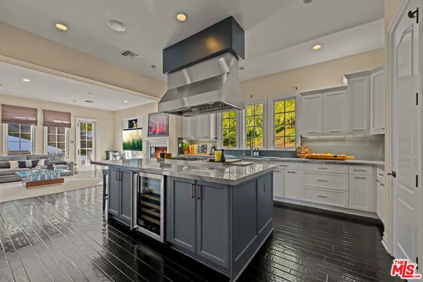 a kitchen with lots of counter top space and dining table