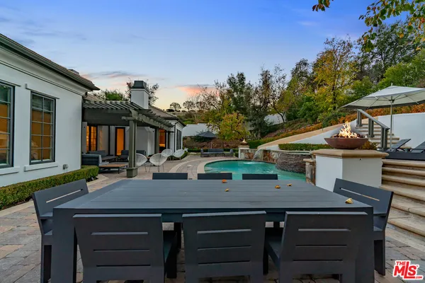 a view of outdoor sitting space with furniture