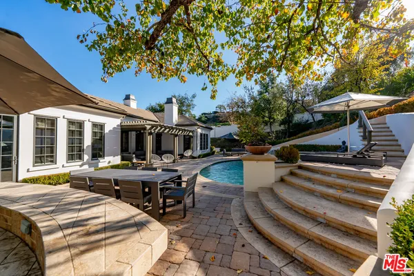 a view of a chairs and tables in patio