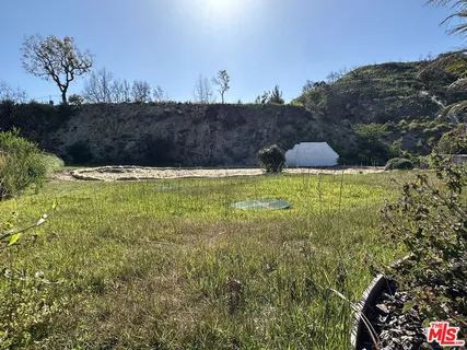 a view of a town with mountains in the background