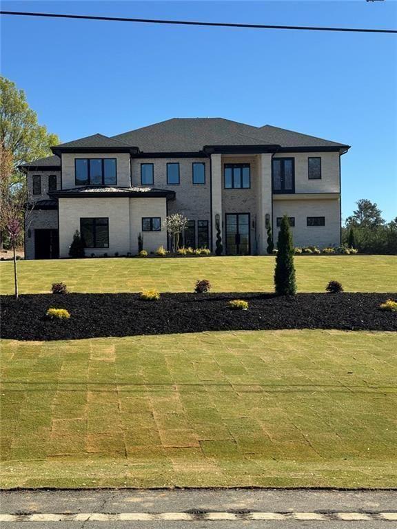 a view of swimming pool with outdoor seating and yard