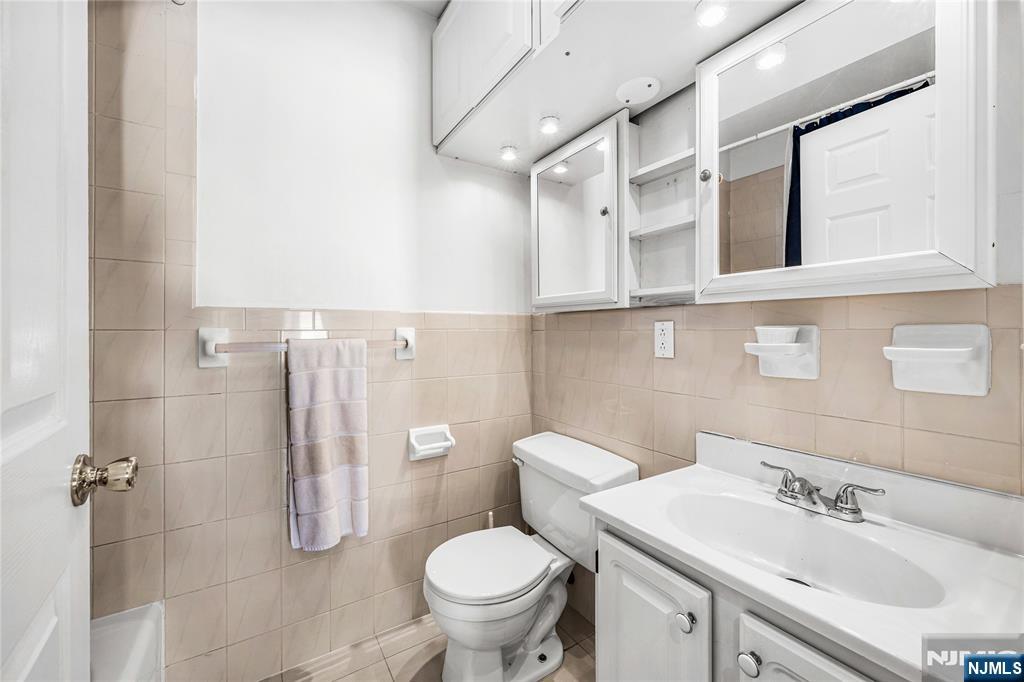84 Union Street Newark, NJ 07105 - Photo 25 of 39 a bathroom with a sink toilet and shower