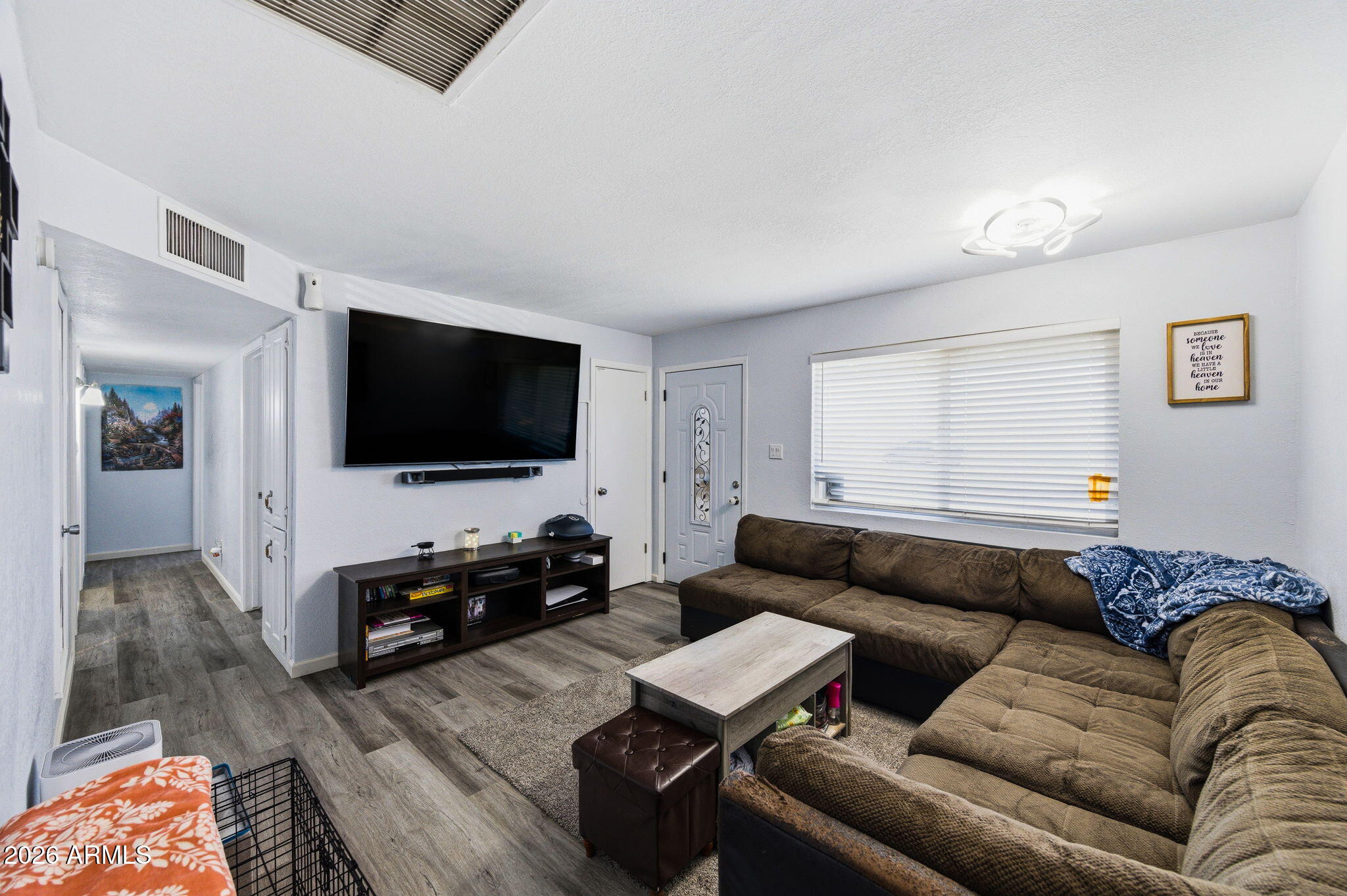 1268 East Rodeo Road Casa Grande, AZ 85122 - Photo 6 of 27 a living room with furniture and a flat screen tv