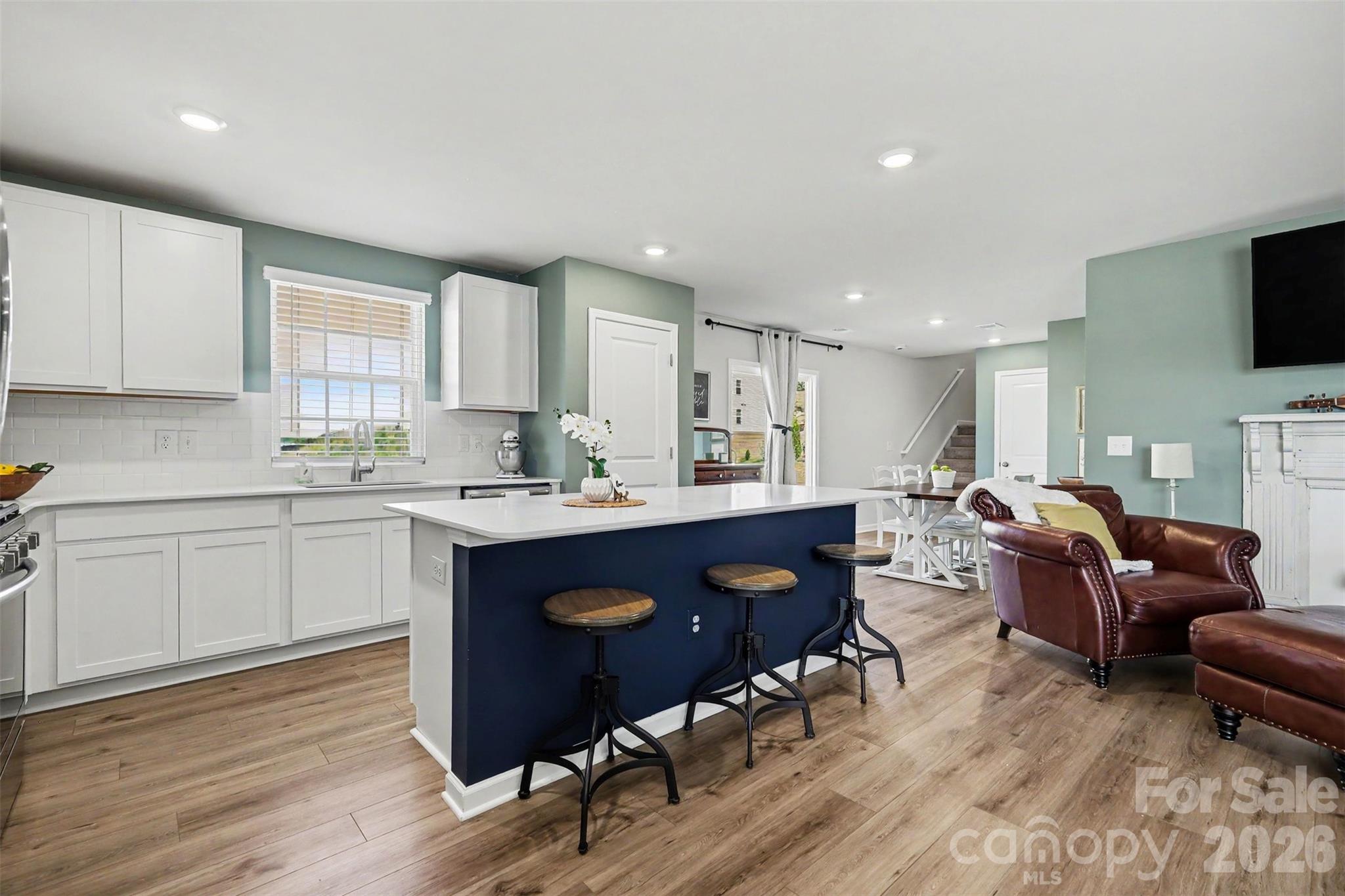 633 Mile Crk Road Edgemoor, SC 29712 - Photo 9 of 26 a kitchen with a sink cabinets and wooden floor