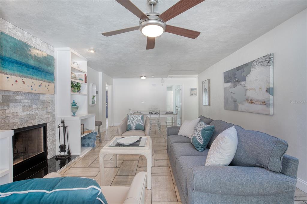 1127 Indigo Road Ormond Beach, FL 32174 - Photo 11 of 94 a living room with furniture and a fireplace