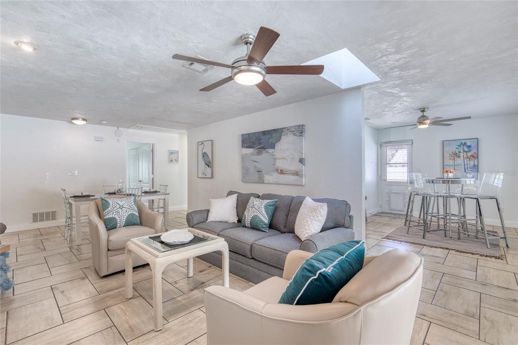 1127 Indigo Road Ormond Beach, FL 32174 - Photo 12 of 94 a living room with furniture and a view of kitchen