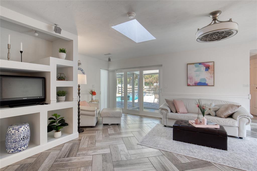 1127 Indigo Road Ormond Beach, FL 32174 - Photo 24 of 94 a living room with furniture and a flat screen tv