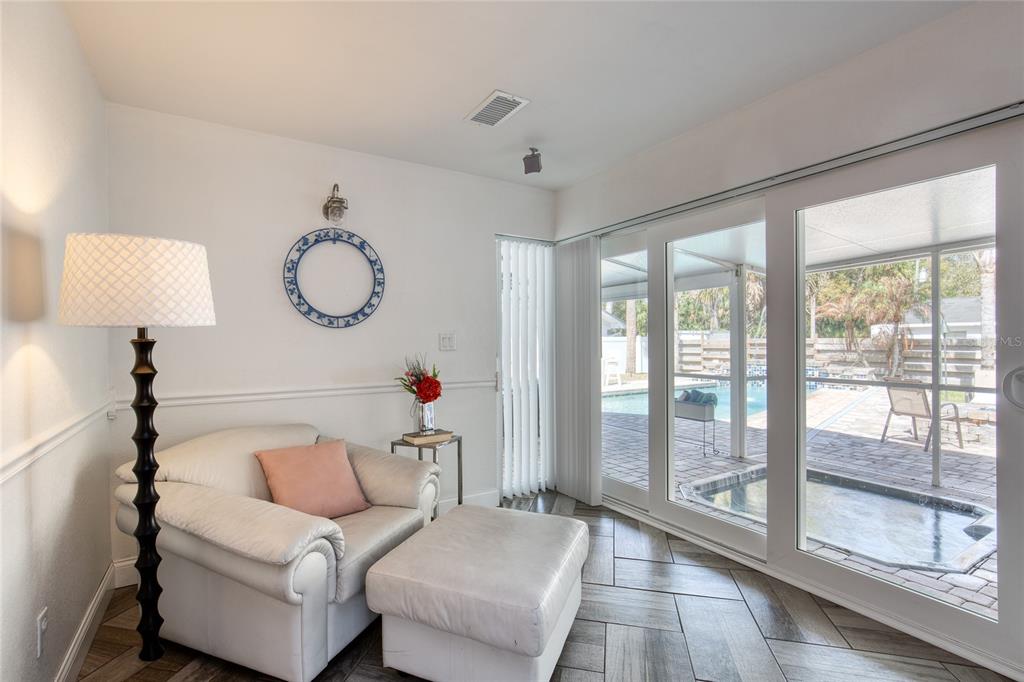 1127 Indigo Road Ormond Beach, FL 32174 - Photo 26 of 94 a living room with furniture and a large window