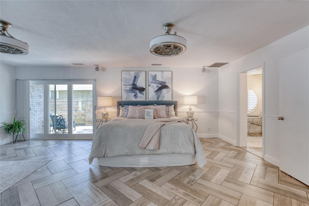 1127 Indigo Road Ormond Beach, FL 32174 - Photo 27 of 94 a living room with furniture and a large window