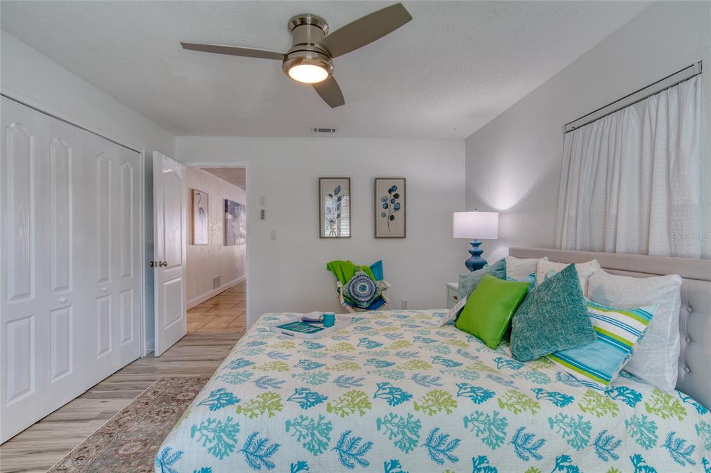 1127 Indigo Road Ormond Beach, FL 32174 - Photo 41 of 94 a bedroom with a bed and painting on the wall