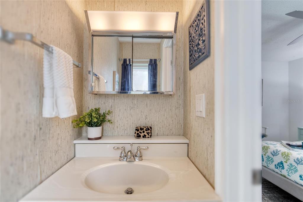 1127 Indigo Road Ormond Beach, FL 32174 - Photo 43 of 94 a bathroom with a sink and a mirror
