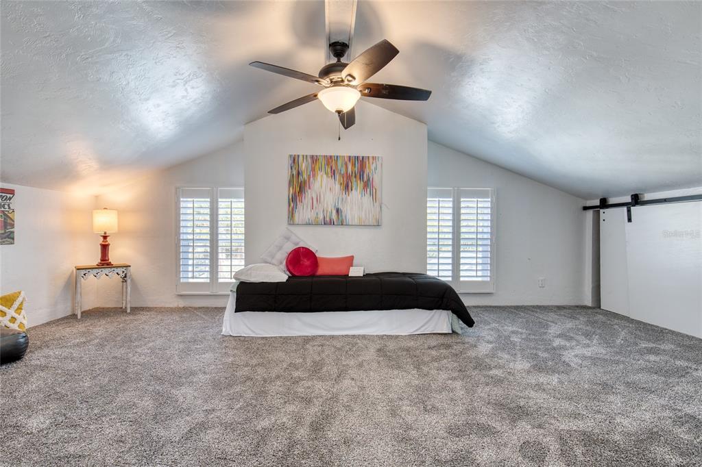1127 Indigo Road Ormond Beach, FL 32174 - Photo 56 of 94 a living room with furniture and a window