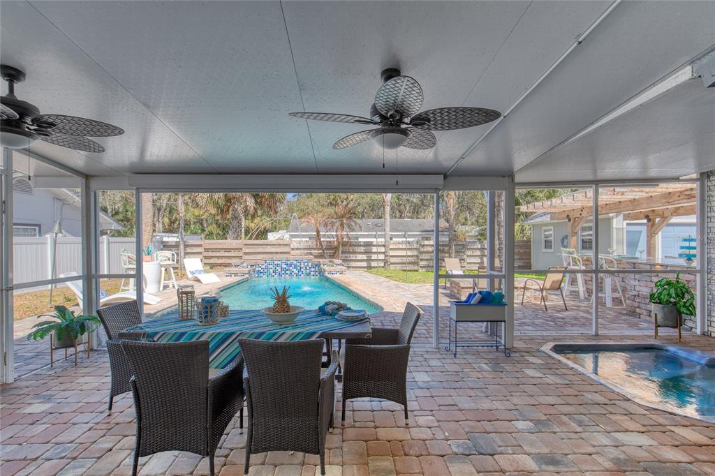 1127 Indigo Road Ormond Beach, FL 32174 - Photo 62 of 94 a view of a dining room with furniture wooden floor and chandelier