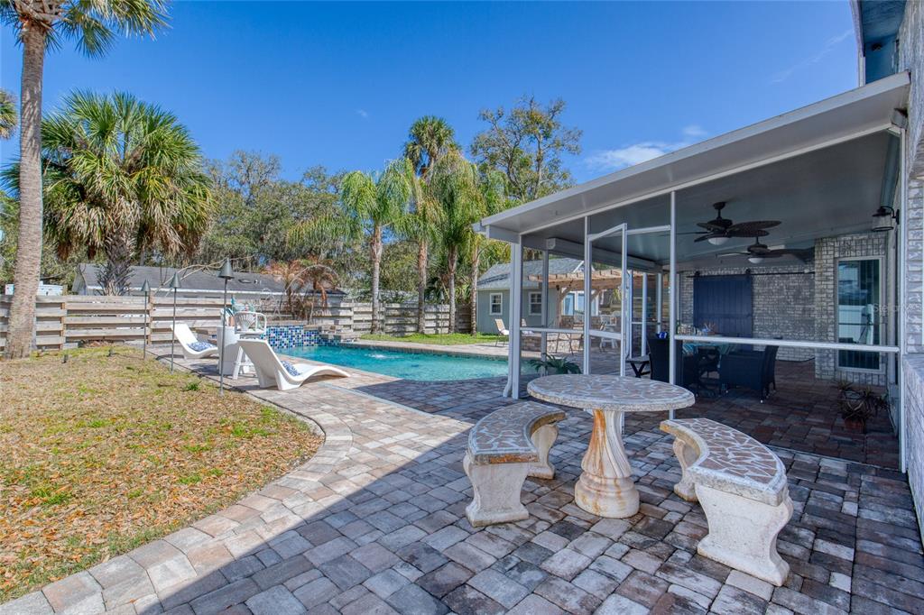 1127 Indigo Road Ormond Beach, FL 32174 - Photo 79 of 94 a view of a backyard with plants and patio