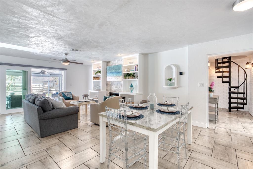 1127 Indigo Road Ormond Beach, FL 32174 - Photo 9 of 94 a living room with furniture a fireplace and a table