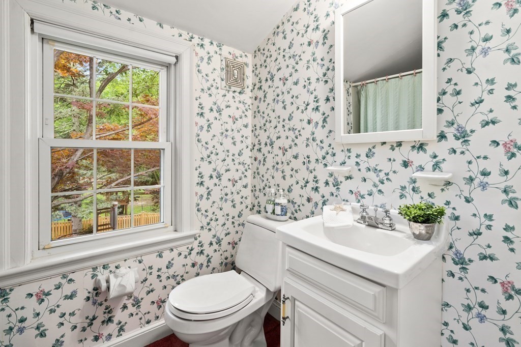 6 Stowecroft Road Arlington, MA 02474 - Photo 12 of 17 a bathroom with a sink a toilet and a window