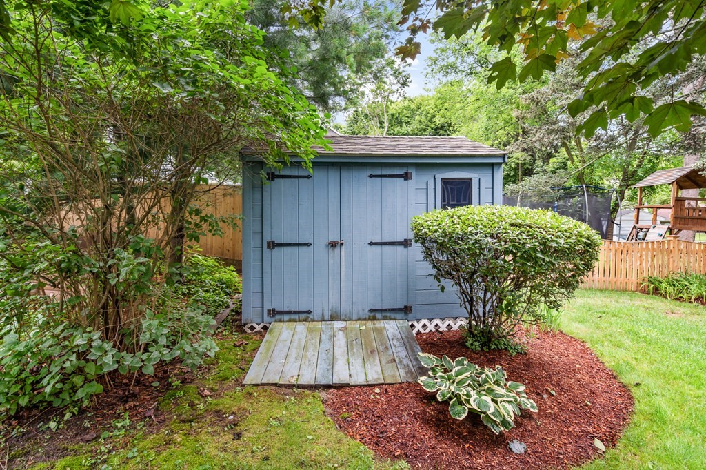 6 Stowecroft Road Arlington, MA 02474 - Photo 15 of 17 a view of a house with a yard plants and large tree