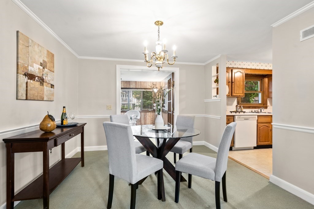 6 Stowecroft Road Arlington, MA 02474 - Photo 6 of 17 a view of a dining room with furniture window and outside view