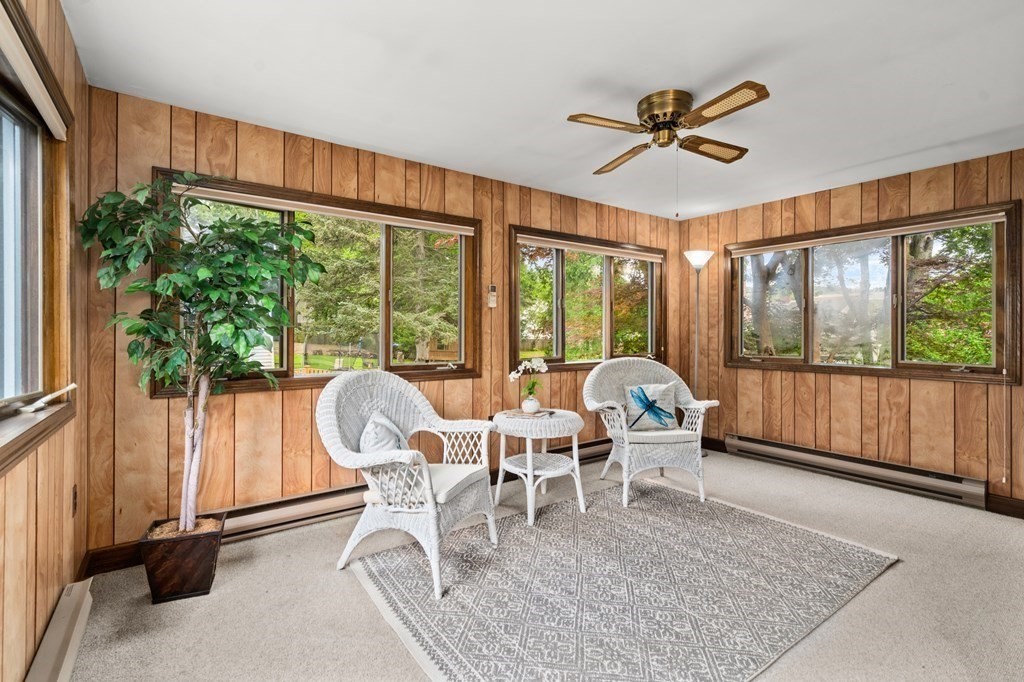 6 Stowecroft Road Arlington, MA 02474 - Photo 9 of 17 a living room with a large window and a table