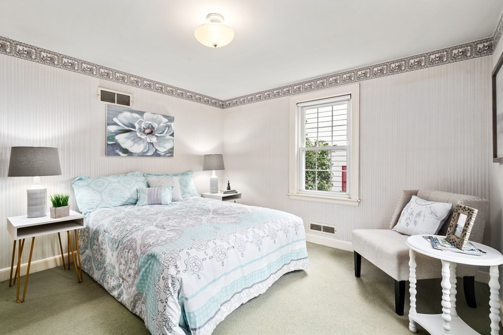 6 Stowecroft Road Arlington, MA 02474 - Photo 10 of 17 a bedroom with a bed and a window