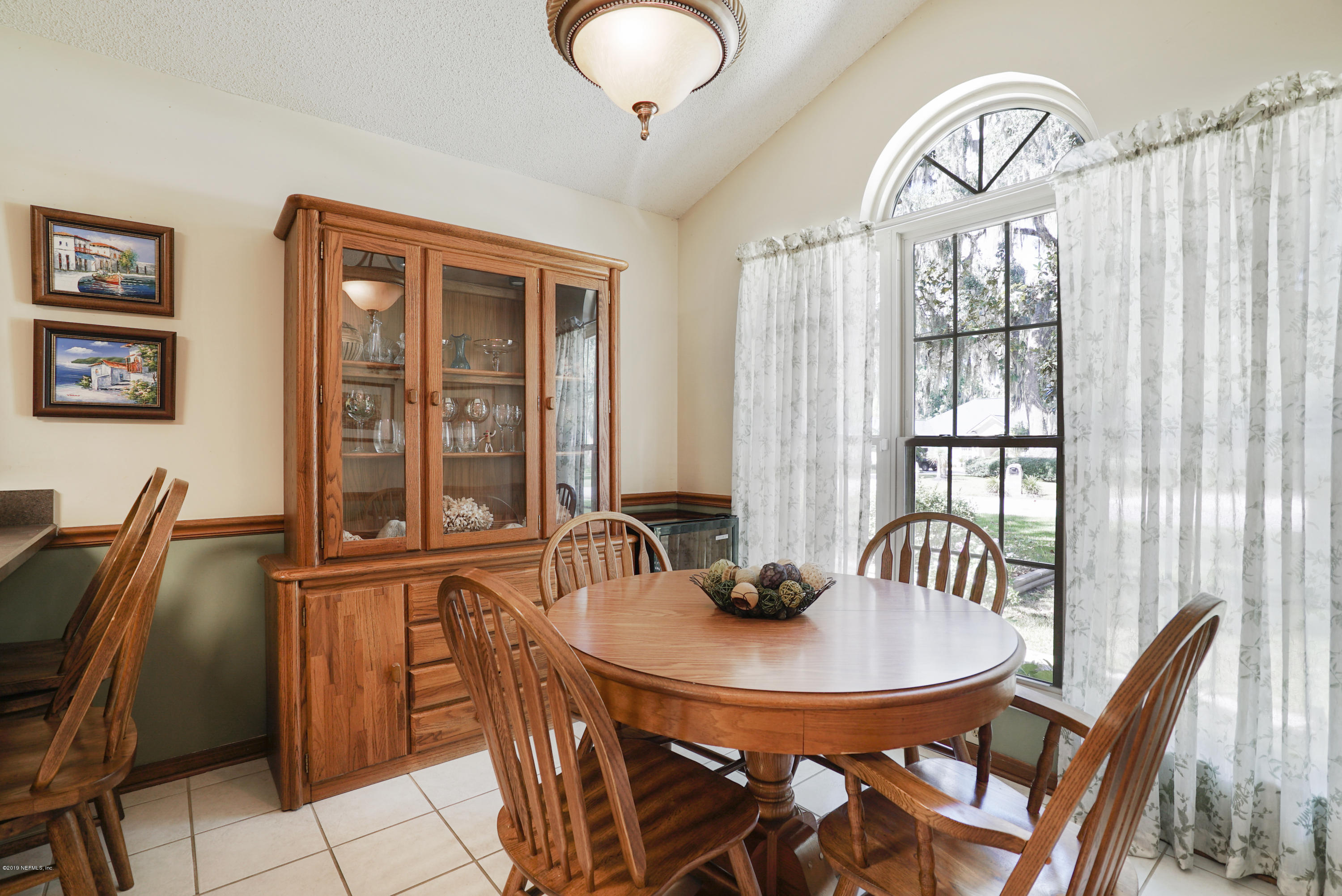 3165 Nautilus Road Middleburg, FL 32068 - Photo 14 of 35 a view of a dining room with furniture window and outside view