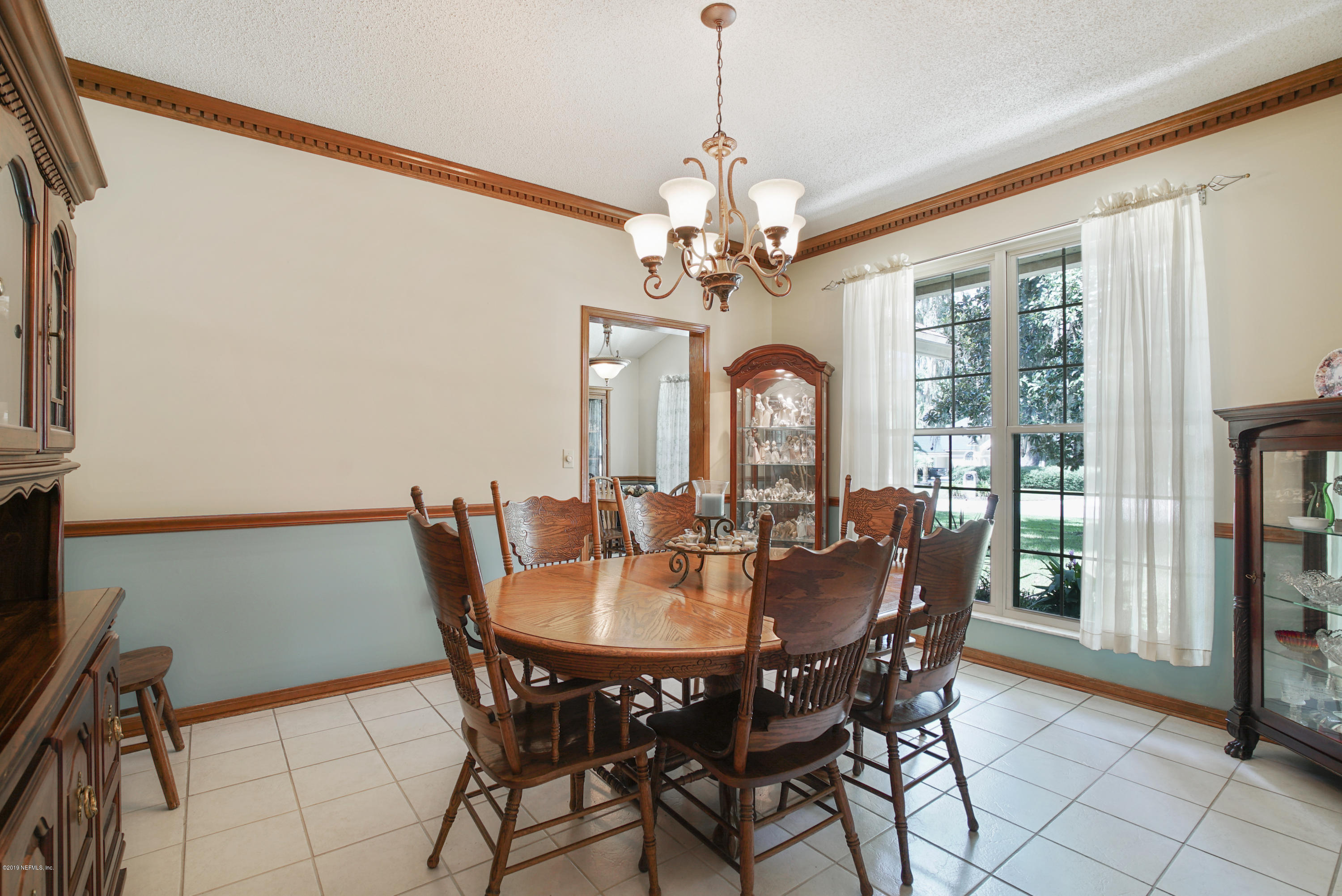 3165 Nautilus Road Middleburg, FL 32068 - Photo 15 of 35 a view of a dining room with furniture window and outside view
