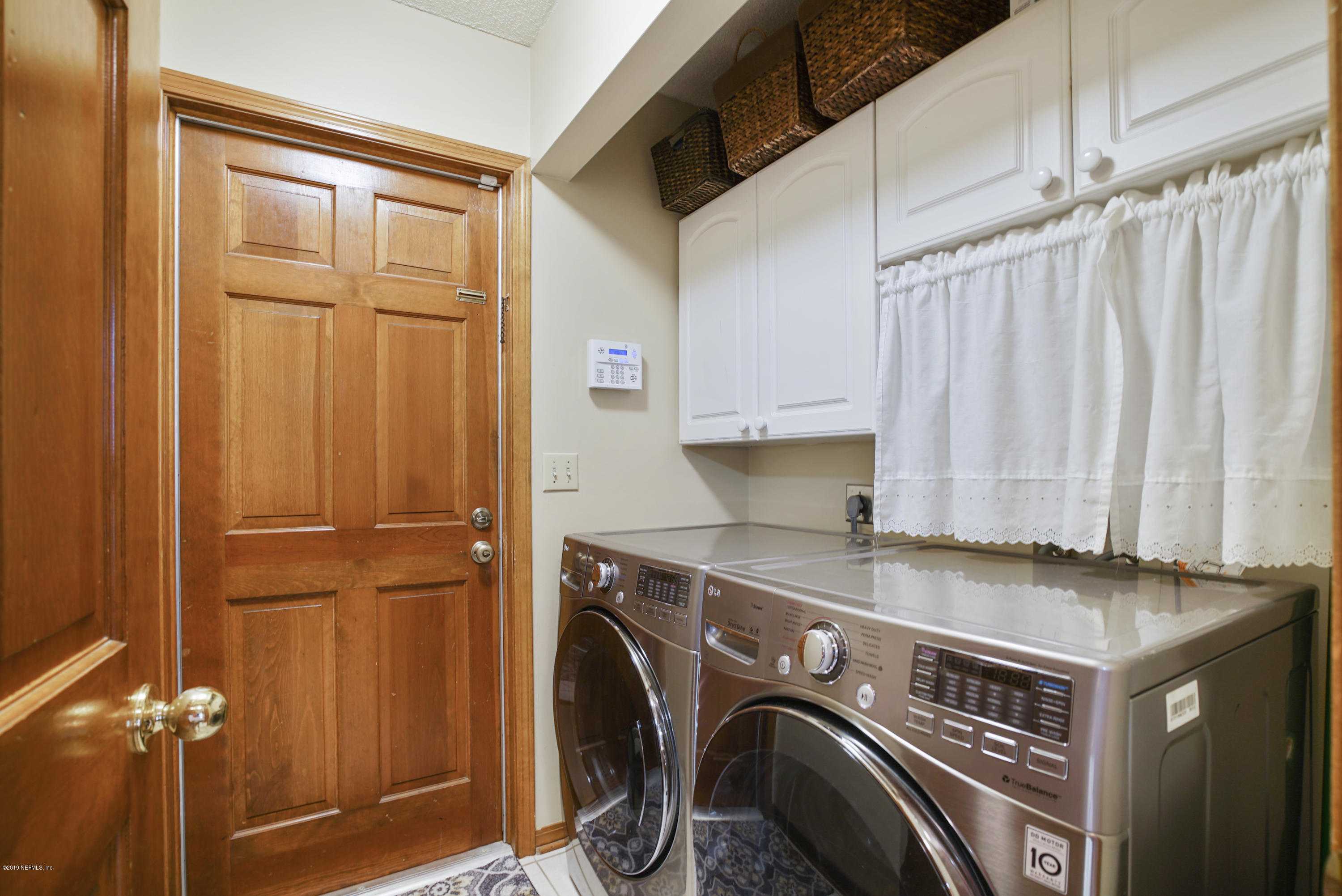 3165 Nautilus Road Middleburg, FL 32068 - Photo 18 of 35 a utility room with dryer and washer