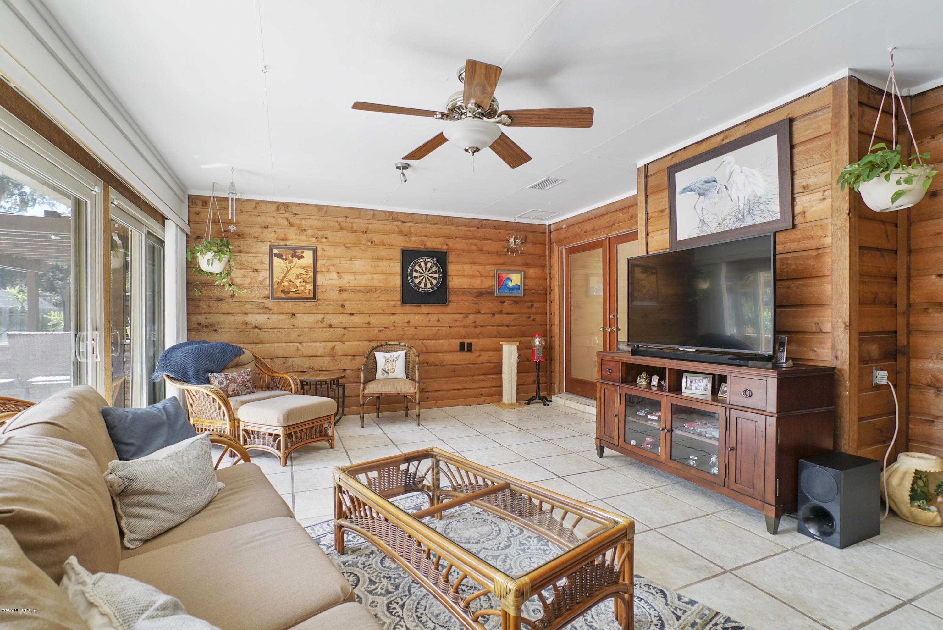 3165 Nautilus Road Middleburg, FL 32068 - Photo 28 of 35 a living room with furniture and a flat screen tv