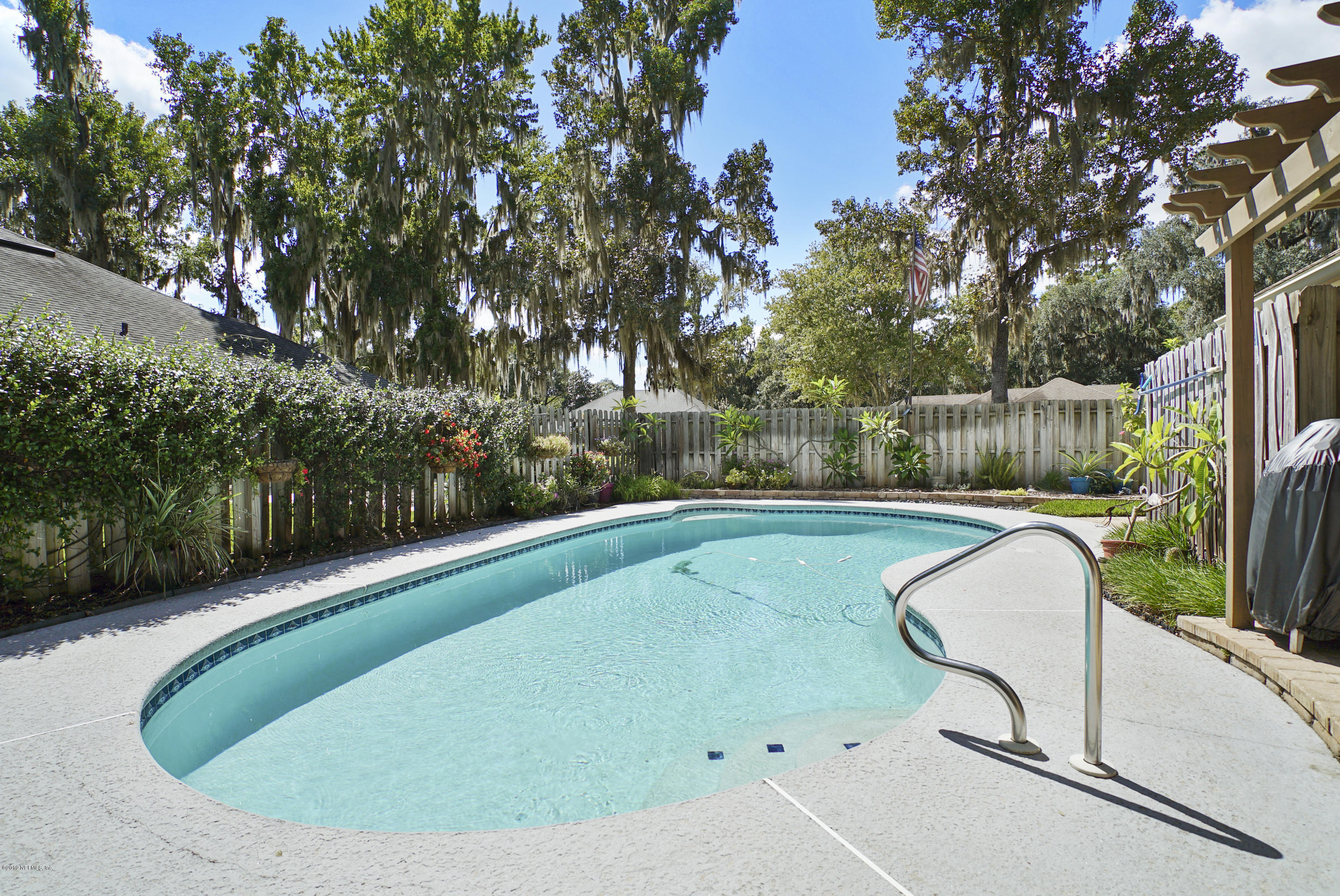 3165 Nautilus Road Middleburg, FL 32068 - Photo 32 of 35 a view of a swimming pool in the backyard of a house