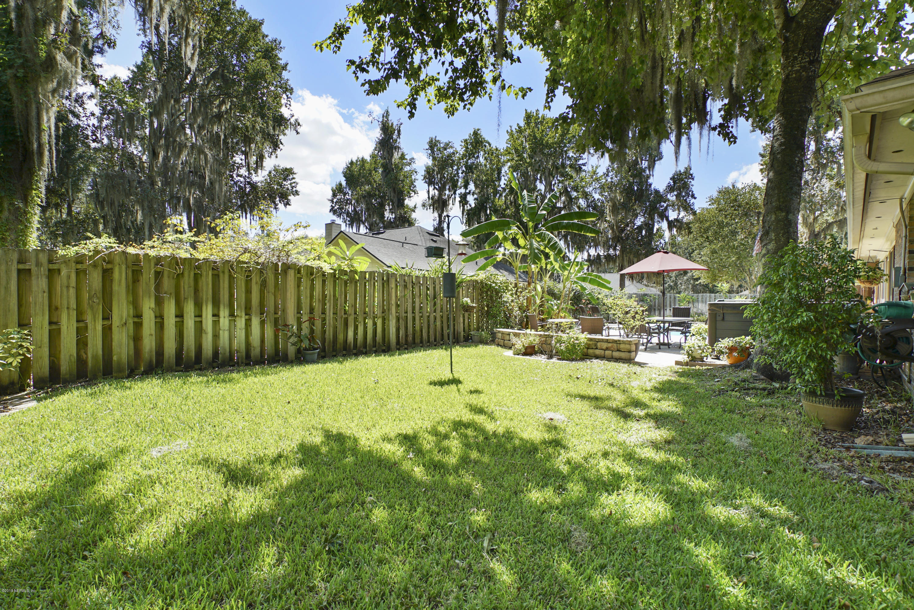 3165 Nautilus Road Middleburg, FL 32068 - Photo 34 of 35 a view of backyard with swimming pool and green space