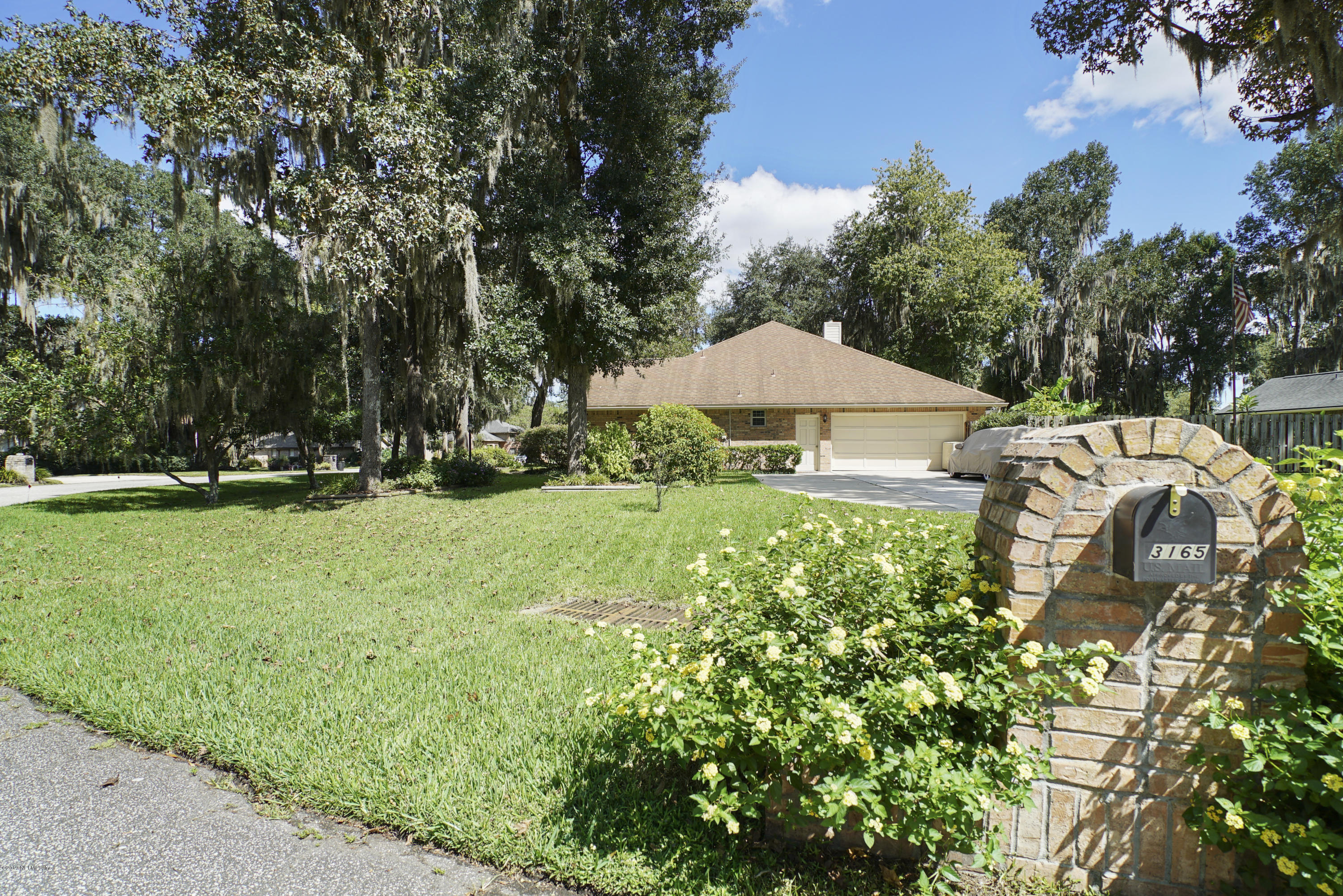 3165 Nautilus Road Middleburg, FL 32068 - Photo 4 of 35 a garden view with a seating space